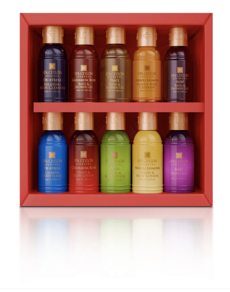 Colorful bottles arranged in a red display box.