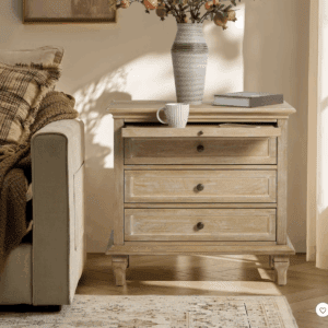 Cozy living room corner with a wooden side table and a vase.