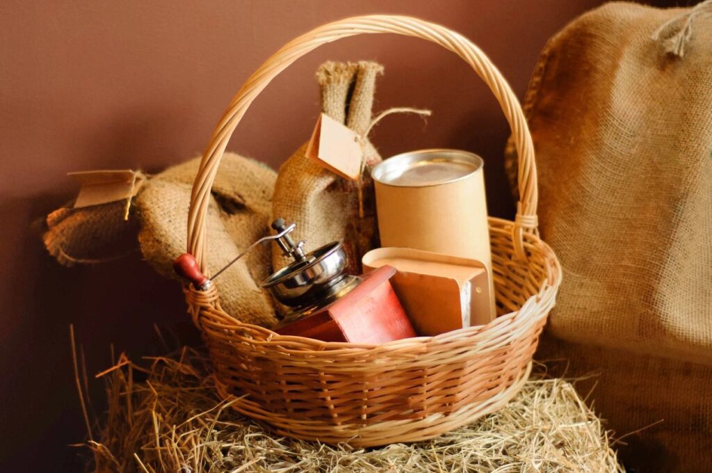 Wicker basket filled with ceramic jars and a wooden spoon.