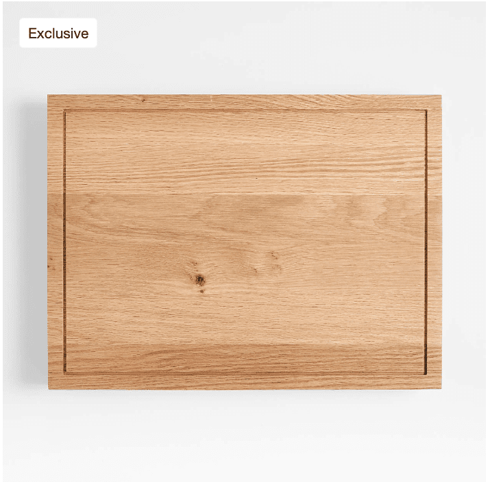 Minimalist wooden cutting board with a rectangular groove.