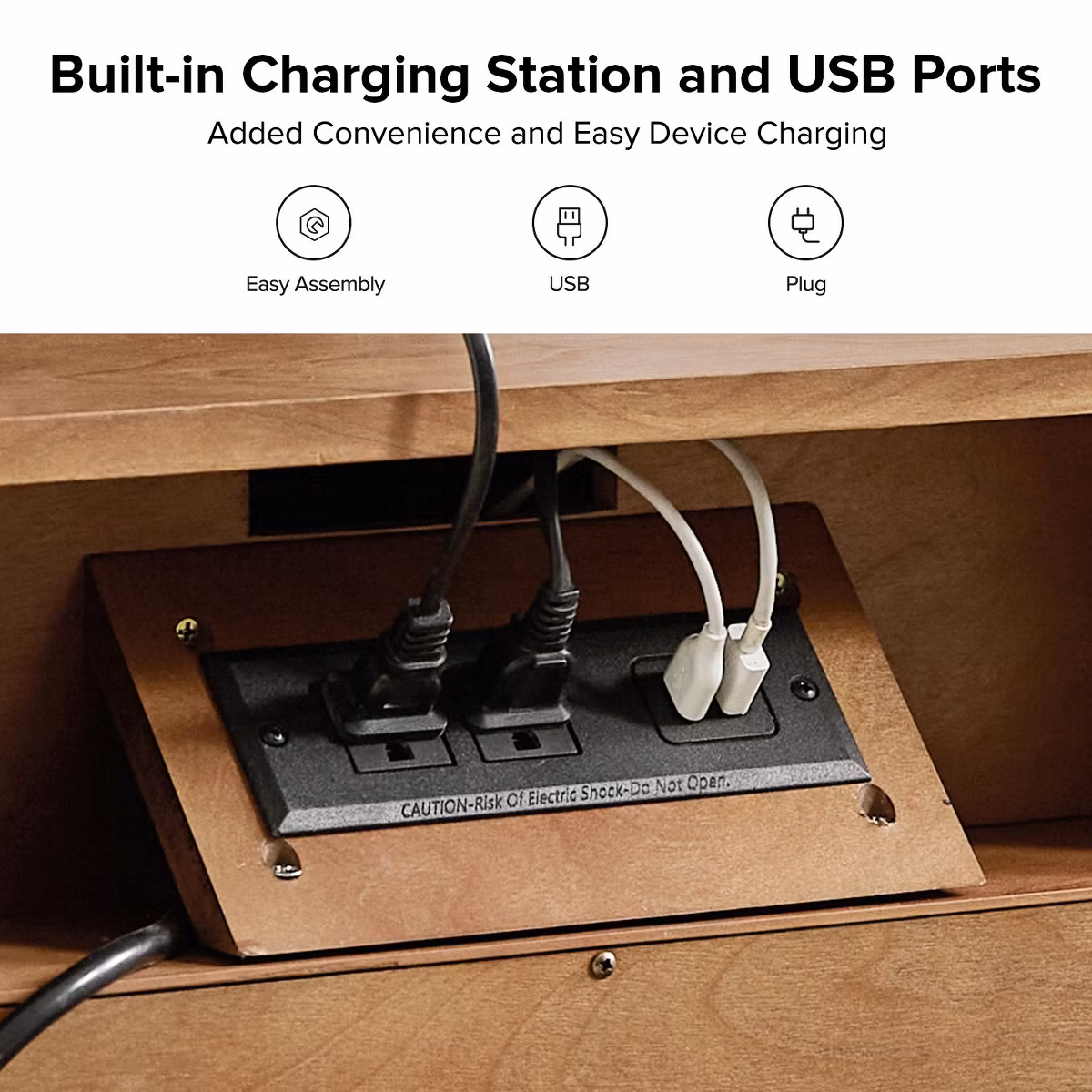 Built-in charging station with multiple USB ports on a wooden desk.