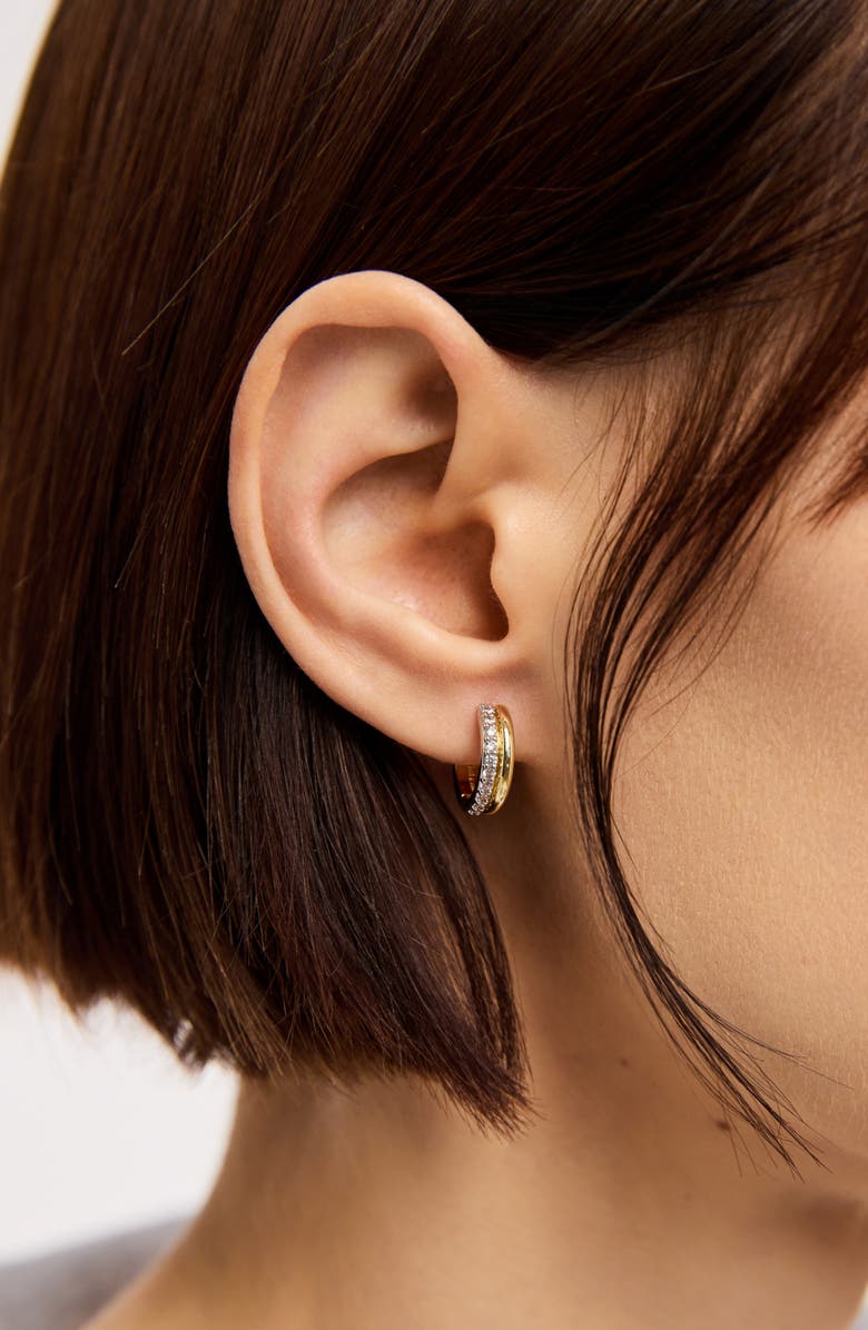 Ear with small gold diamond hoop earring