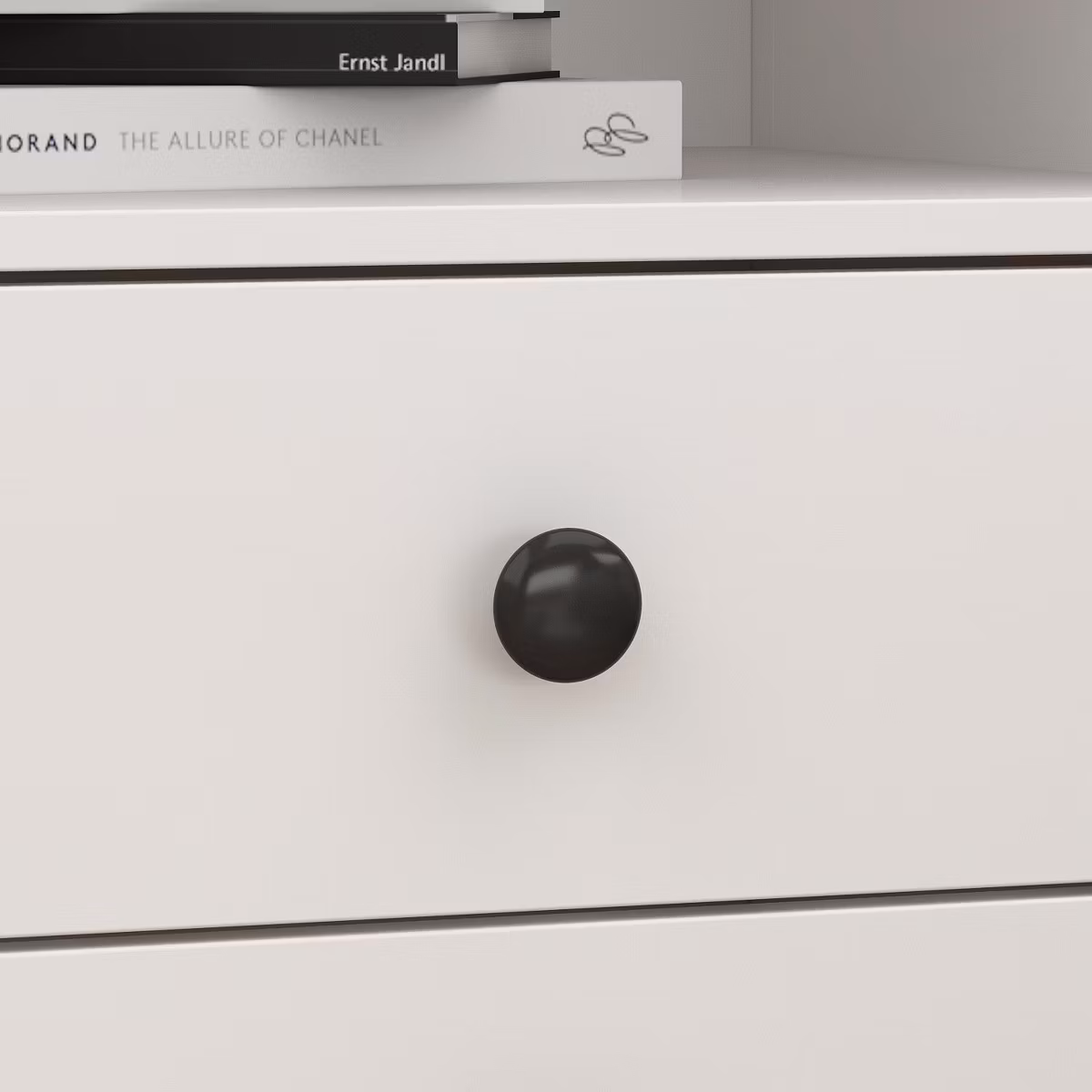 White dresser drawer with black round knob
